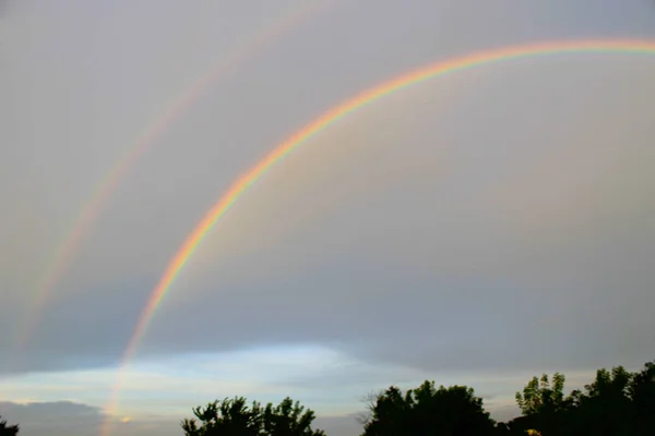 Rural landscape with rainbow — Stock Photo, Image