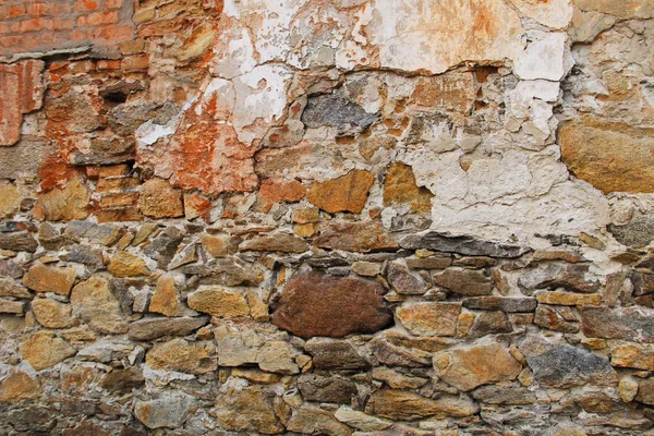 Sfondo del vecchio muro di pietra intemperie — Foto Stock