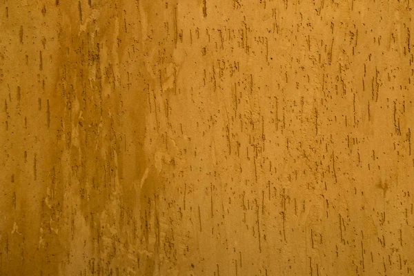 Текстура стіни покрита помаранчевою ліпниною — стокове фото