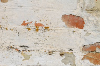 Soyulmuş alçılı eski, eski, kirli tuğla duvarın arka planı