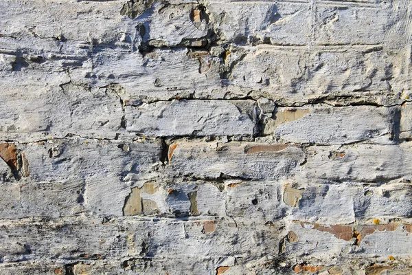 Hintergrund der alten, schmutzigen Ziegelwand mit abblätterndem Putz — Stockfoto
