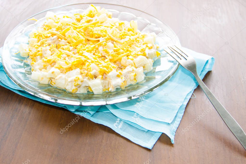 Festive salad with chicken breast, sweet corn, cheese and pineapple