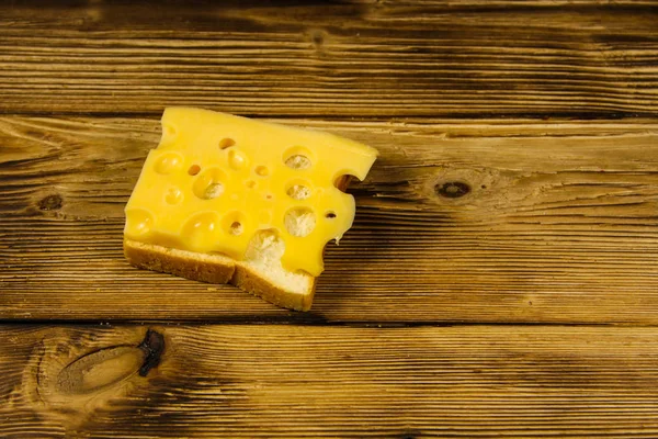 Cheese sandwich on wooden table — Stock Photo, Image