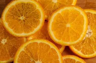 Dilimlenmiş sulu portakal meyvelerinin arka planı