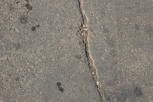 Asfalt zemininde çatlaklar olan doku — Stok fotoğraf