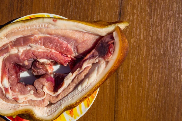 Fresh raw pork belly on wooden table — Stock Photo, Image