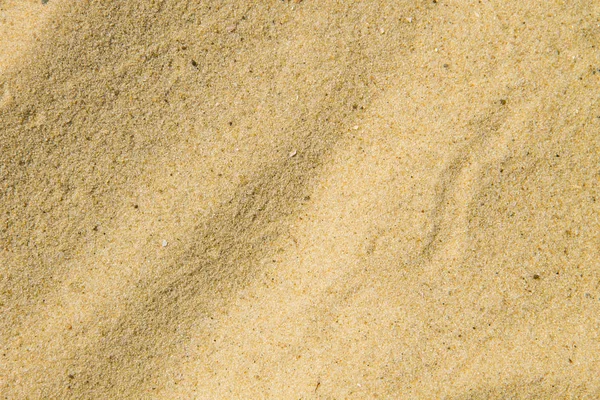 Textura de arena. Playa de arena para el fondo — Foto de Stock