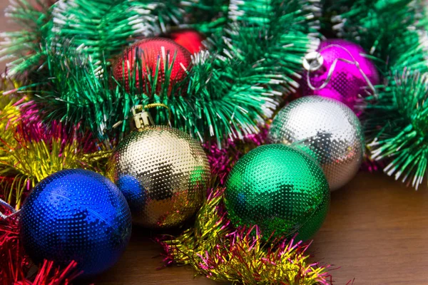 Christmas decoration with colored xmas balls and tinsel — Stock Photo, Image