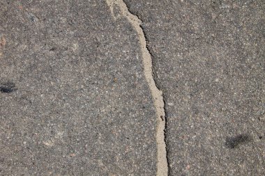 Asfalt zemininde çatlaklar olan doku