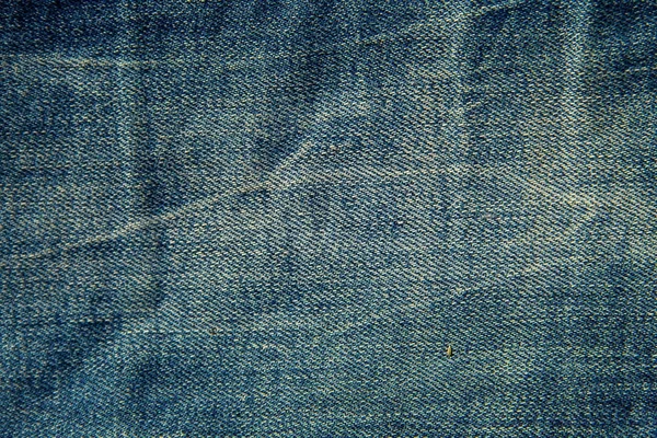 Jeans textuur achtergrond. Onderdeel van de blauwe jeans — Stockfoto