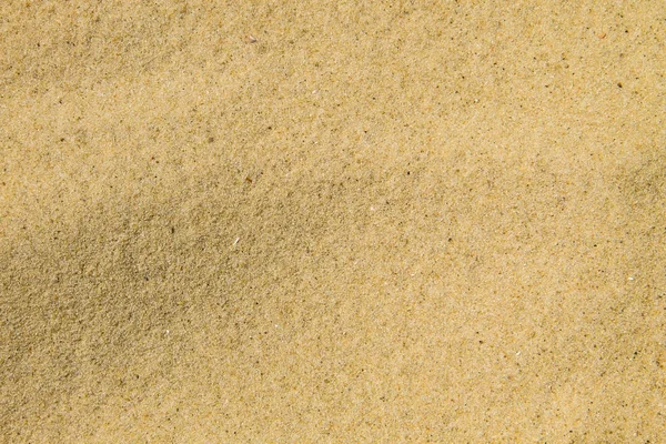Textura de arena. Playa de arena para el fondo — Foto de Stock