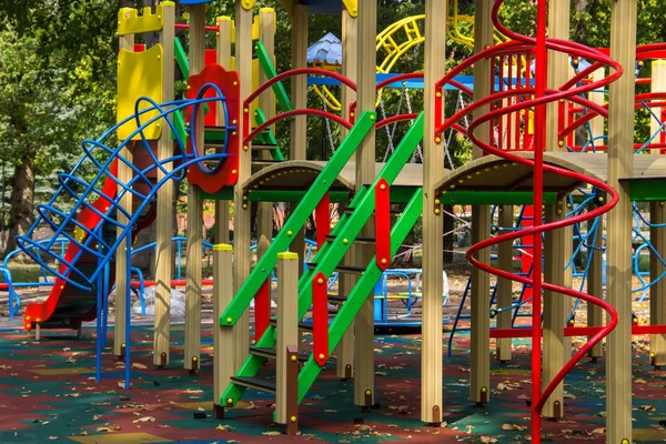 Colorful playground equipment for children in public park — Stock Photo, Image