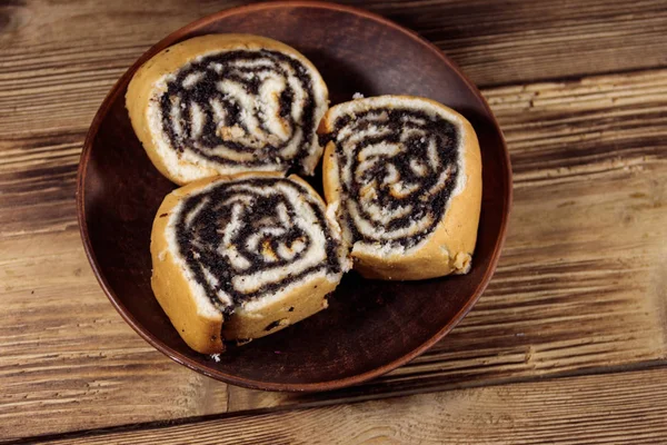 Poppy seed rolls on wooden table — Stock Photo, Image