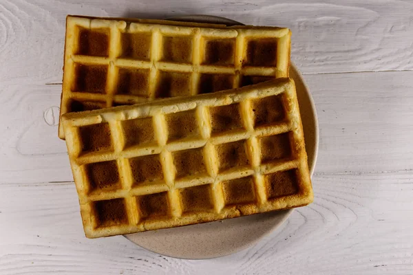 Belgian waffles on white wooden table. Top view — Stock Photo, Image