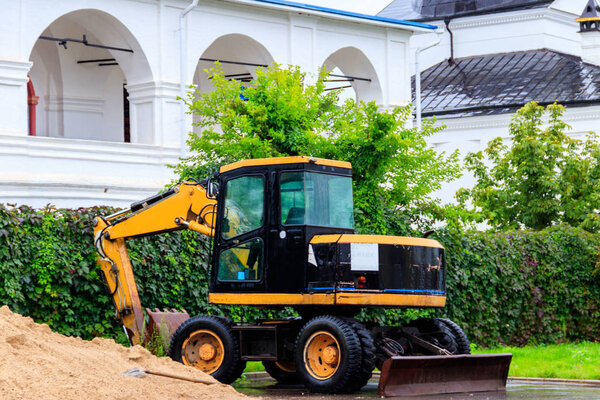 Industrial excavator at construction site in a city