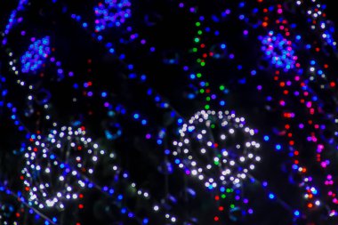 Noel arkaplanı. Bokeh bulanık ışıkları olan şenlikli xmas soyut arkaplan