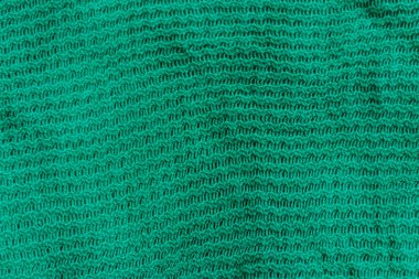 Yeşil örgü doku. Örme kumaş arka plan