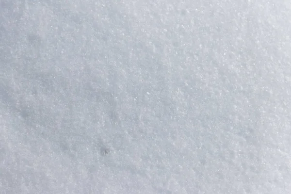Textur des weißen Schnees. Winterlicher Hintergrund — Stockfoto