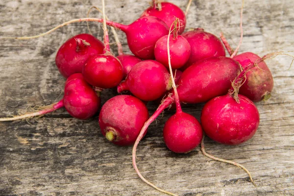 Heap of radish on wooden table. Top view — Stock Photo, Image
