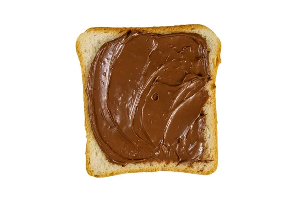 Slice of bread with delicious chocolate hazelnut spread isolated on white background — ストック写真