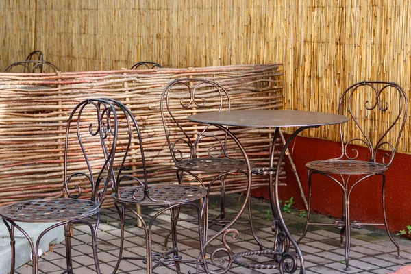 Chairs and tables in cozy outdoor cafe at summer — Stock Photo, Image