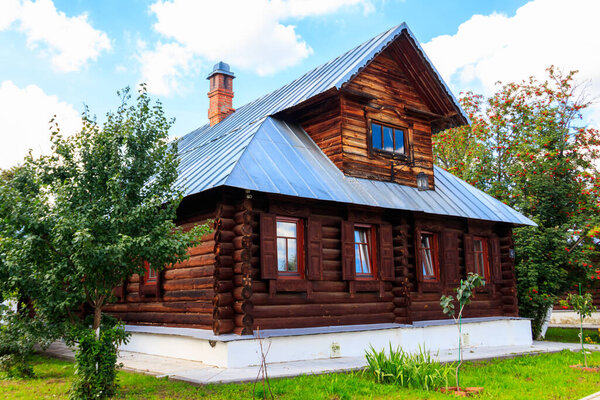 Old wooden log house in a russian village