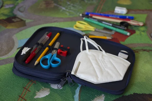 Coronavirus school, mask in the case, in the classroom