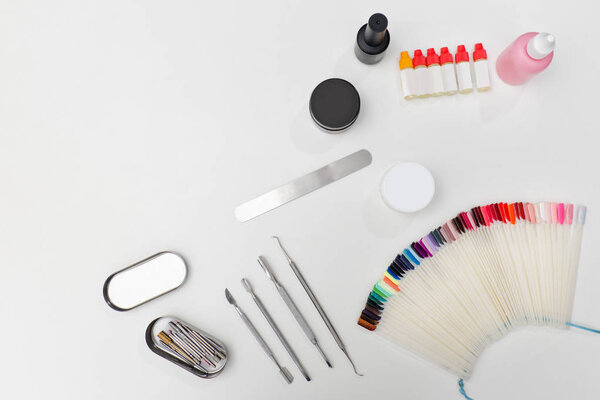 Set for manicure. Tools, nail file, palette, care products. White background. Space for text