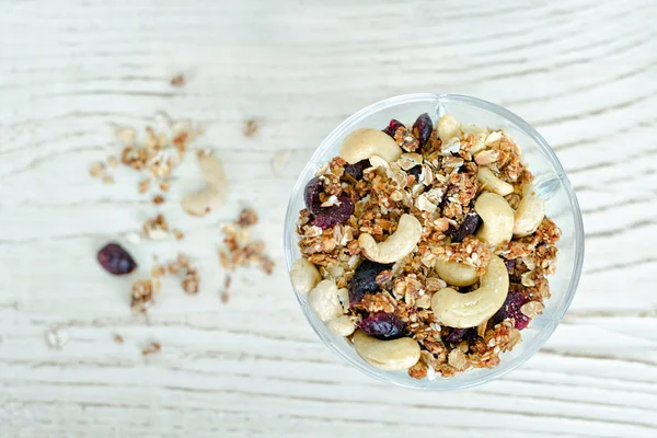 Pialat granola with nuts on a white table. Close-up — Stock Photo, Image