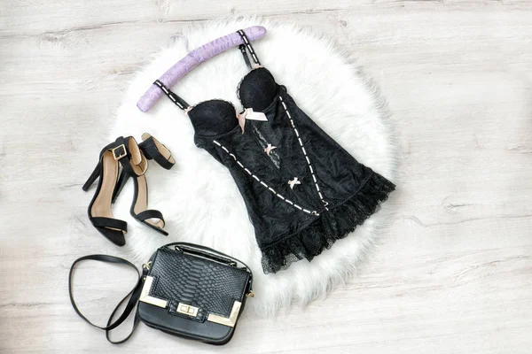 Fashionable concept. Black lacy underwear, handbag and shoes on the white fur. — Stock Photo, Image