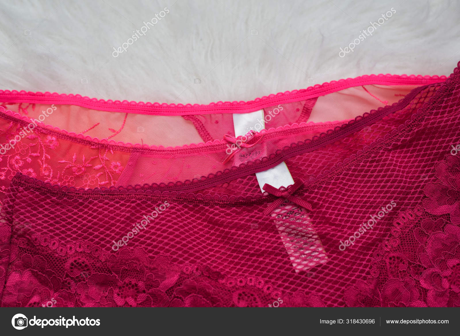 Part of two lacy pink panties on white fur. Close up. Fashionable concept  of lingerie Stock Photo by ©SomeMeans 318430696