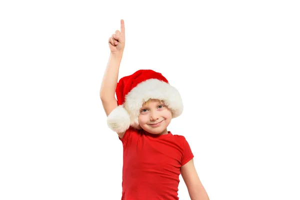 Blondyn w czapce Mikołaja wskazuje palcem w górę. Izolacja — Zdjęcie stockowe