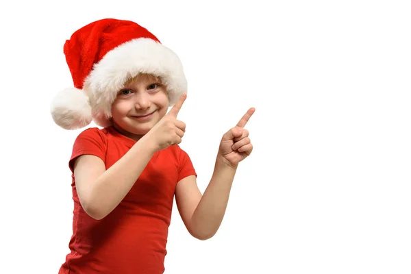 Blondyn w czapce Mikołaja wskazuje palcem. Izolacja — Zdjęcie stockowe