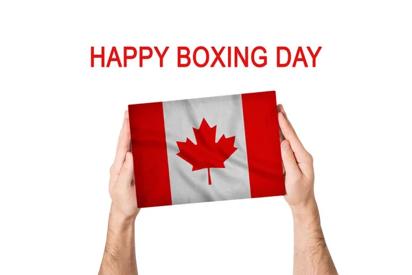 Mutlu boks günleri. Erkek ellerinde Kanada bayrağı olan bir kutu. Beyaz arkaplan — Stok fotoğraf