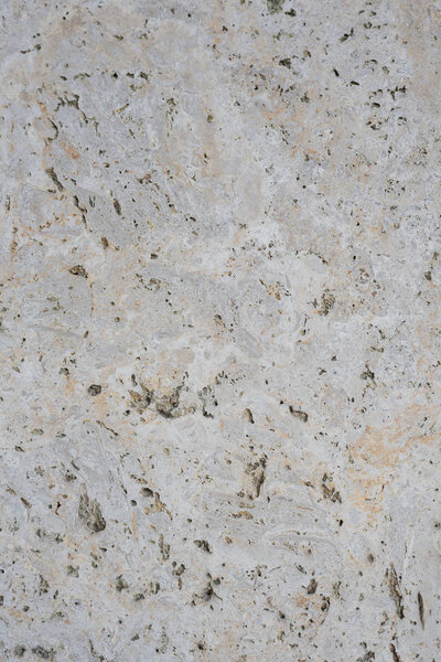 Roughly processed marble slab. Top view. Backgrounds and textures. Close up