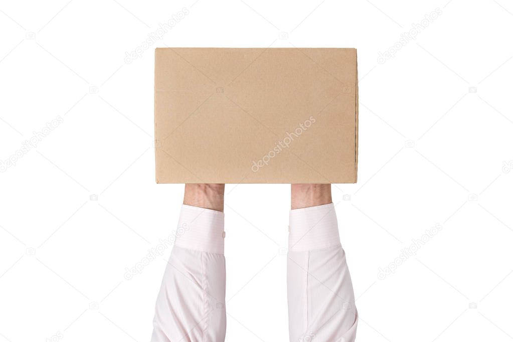 Man holding a rectangular cardboard box on white background. Top view