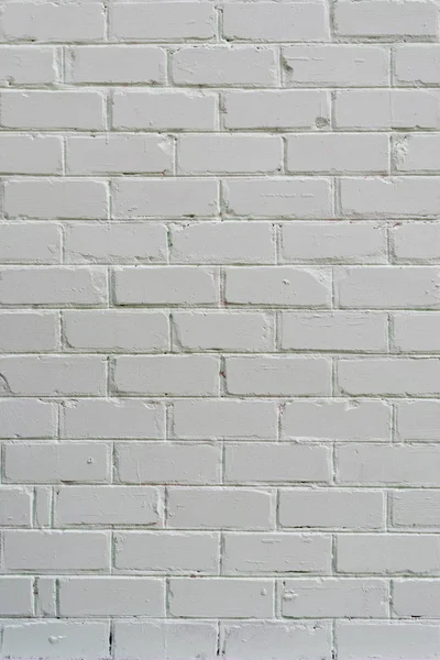 Біла гранжева цегляна стіна. Фон, простір копіювання, вертикальна рамка — стокове фото