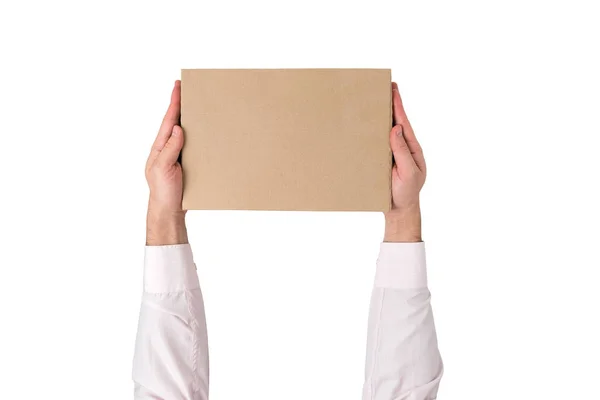 Rectangular box in male hands isolated on white background. Top view — Stock Photo, Image