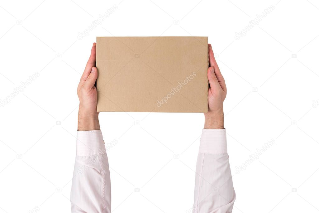 Rectangular box in male hands isolated on white background. Top view