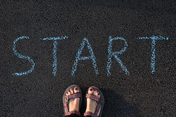 Selfie feet. Feet on the pavement next to start. Concept started