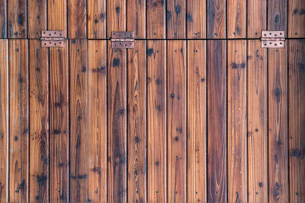 door loops in wooden doors. Rural rustic style. Rough wood surface.