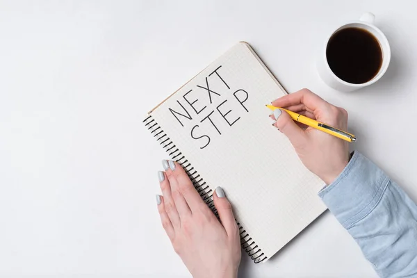 Next Step Notice Notepad White Background Words Handwritten Women Hands — Stock Photo, Image