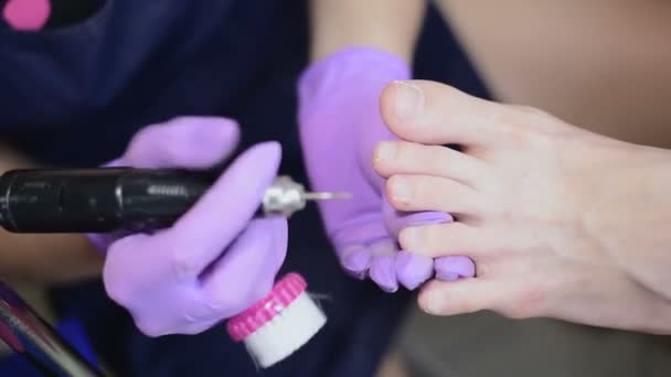 Manicure master during professional hardware manicure using electric machine. Procedure in SPA salon. — Stock Video