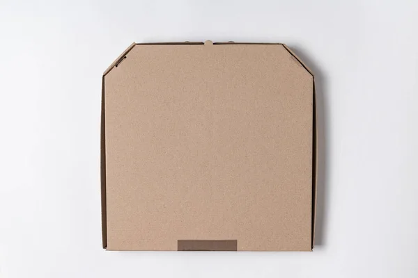 Cardboard pizza box on white background. Mockup, place for text