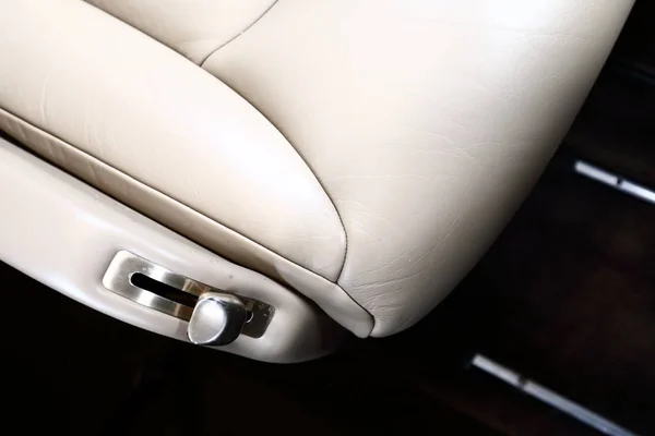 Edge of the leather seat with the lever — Stock Photo, Image