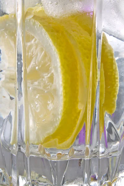 Lemon with ice in a glass abstract — Stock Photo, Image