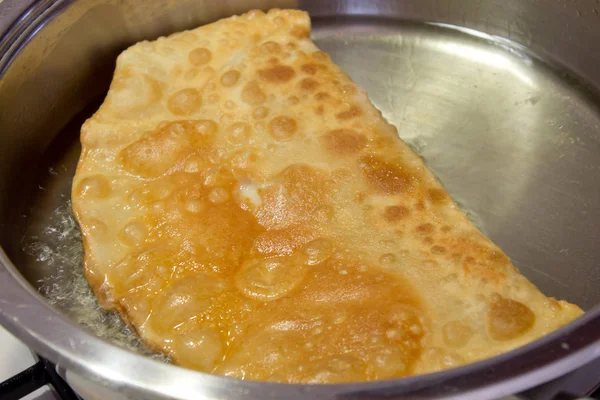 Cheburek fried on a pan — Stock Photo, Image