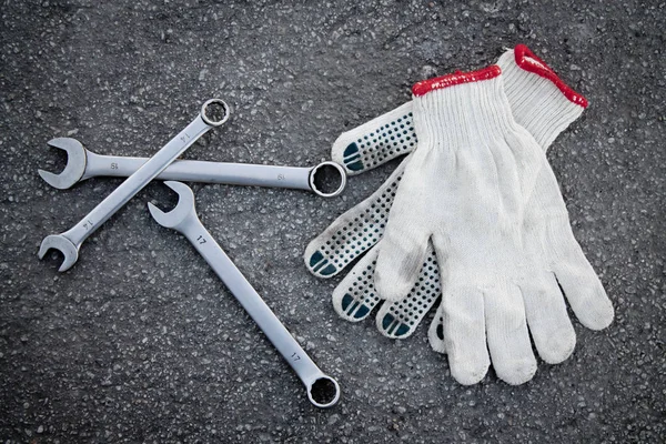 open-end wrench and gloves