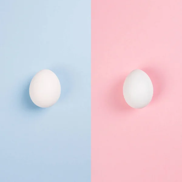 White eggs on blue and pink background. Concept gender stereotyp — Stock Photo, Image