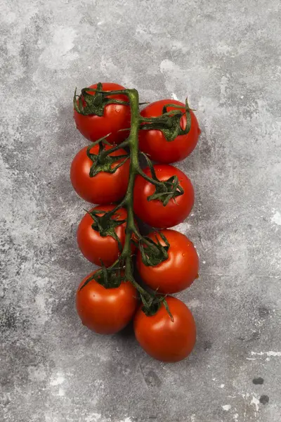 Red cherry tomatoes on gray background. Top view. Food backgroun — Stock Photo, Image